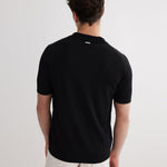 Lars Black Polo Shirt with Button Fastening | Moeva | T-Shirt | Each week unveils new pieces—luxury swimwear, fluid resort silhouettes, and elevated summer-to-evening essentials designed to carry you from coastal escapes to city nights.