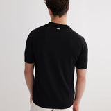 Lars Black Polo Shirt with Button Fastening | Moeva | Men Classic Collar Shirts | Each week unveils new pieces—luxury swimwear, fluid resort silhouettes, and elevated summer-to-evening essentials designed to carry you from coastal escapes to city nights.