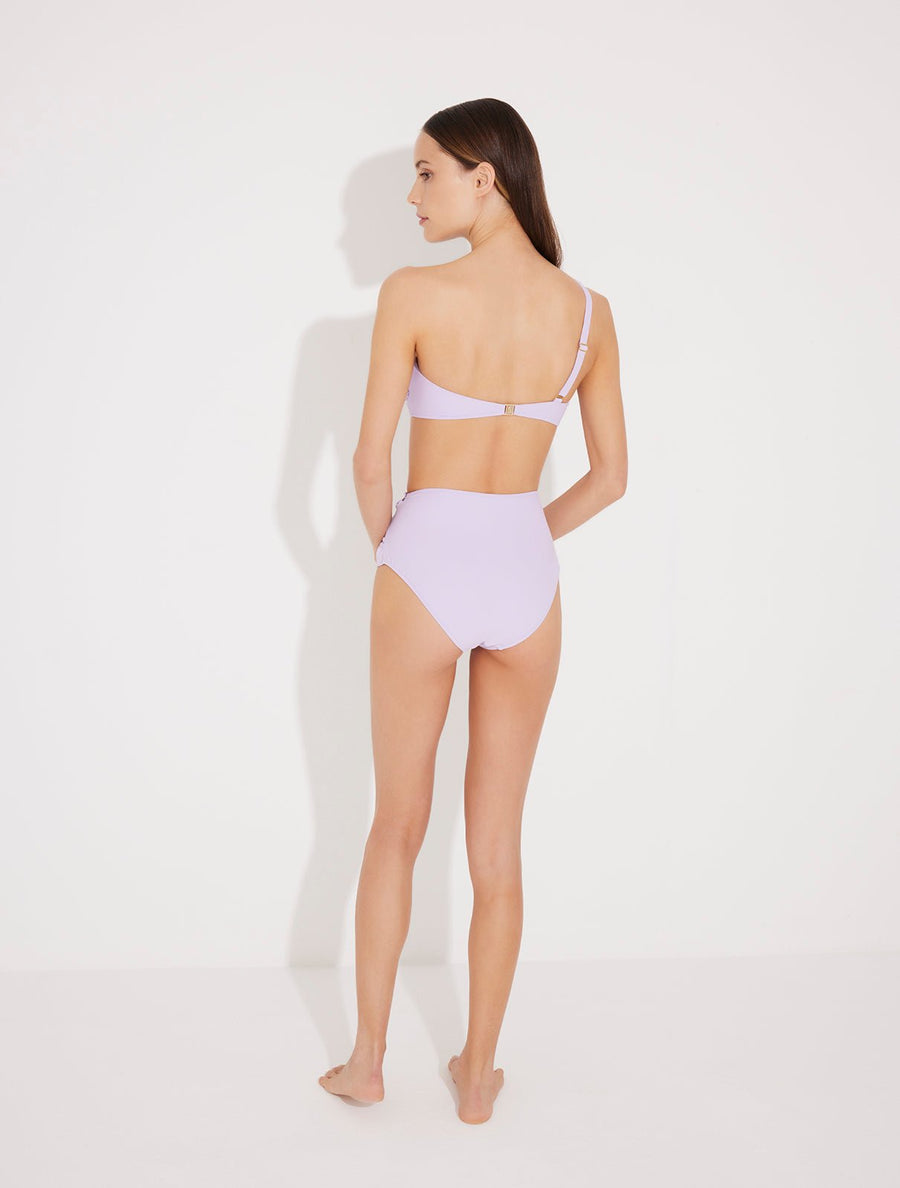 Back View: Model in Lilla Lilac Bikini Bottom - Moderate Bottom Coverage, Quick-Drying Italian Fabric, High-Waisted Swim Bottom, Special Lycra Xtralife Certificate, MOEVA Luxury Swimwear  