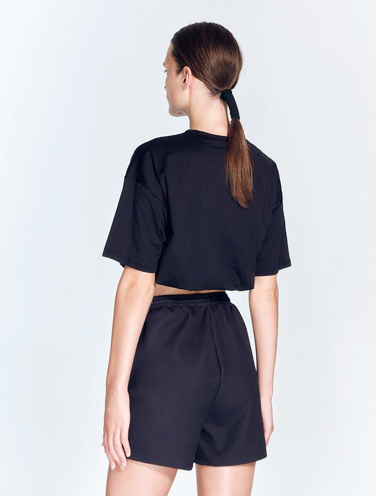 Linette Black Shorts | Moeva | Activewear | Each week unveils new pieces—luxury swimwear, fluid resort silhouettes, and elevated summer-to-evening essentials designed to carry you from coastal escapes to city nights.