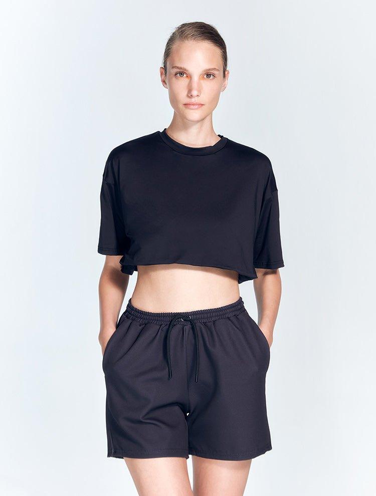 Linette Black Shorts | Moeva | Activewear | Each week unveils new pieces—luxury swimwear, fluid resort silhouettes, and elevated summer-to-evening essentials designed to carry you from coastal escapes to city nights.