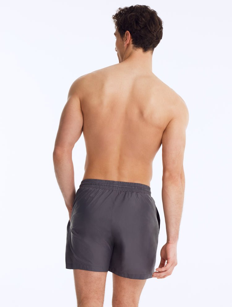 Back View: Louis Dark Grey Shorts on Model - Drawstring Waist, Mid Length, Quick Dry, MOEVA Luxury Swimwear   
