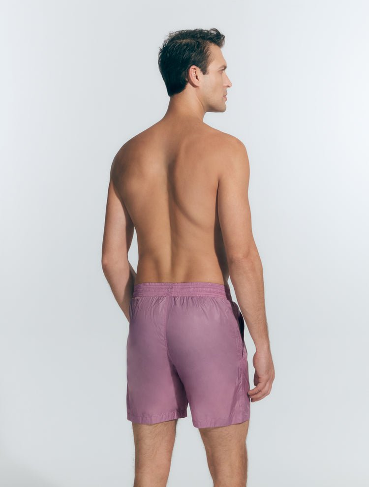 Back View: Model in Louis Lilac Shorts - MOEVA Luxury Swimwear, Men	Swim Shorts, Nikel, Mid Length Swim Shorts, Fully Lined, Slim Fit, Quick Dry, MOEVA Luxury Swimwear