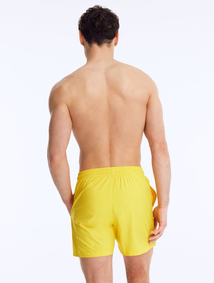 Back View: Louis Yellow Shorts on Model - Drawstring Waist, Mid Length, Quick Dry, MOEVA Luxury Swimwear   