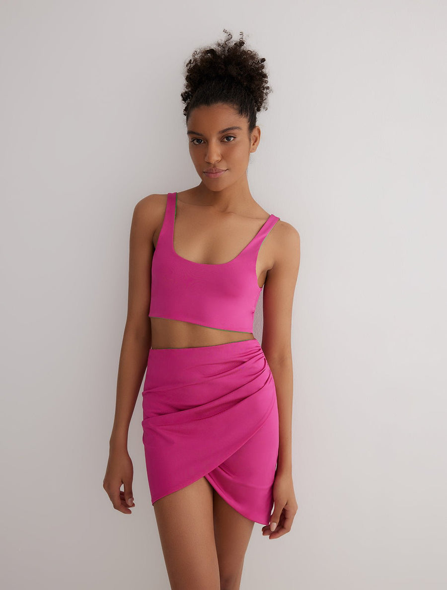 Front View: Model in Lupe Green/Pink Skirt - Wrapped Skirt, Slim Fit, MOEVA Luxury Swimwear