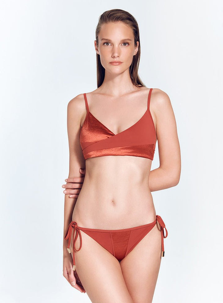 Front View: Model in Maelys Red Ochre Bikini Bottom - Satin Matte Contrast, Low Rise, Straps Ties at the Side, Moderate Coverage, MOEVA Luxury Swimwear