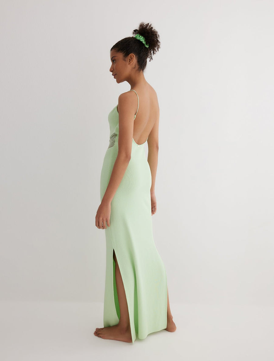 Back View: Model in Malin Mint Green Dress - MOEVA Luxury Swimwear, Semi-Sheer Panels, Ankle Length, MOEVA Luxury Swimwear