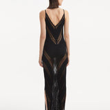 Back View: Model in Mimi Black Dress - MOEVA Luxury Swimwear, Knitted Maxi Dress, Comfortable Fit, Unlined, Day to Night and Signature, Slit Details, Close Fit, MOEVA Luxury Swimwear