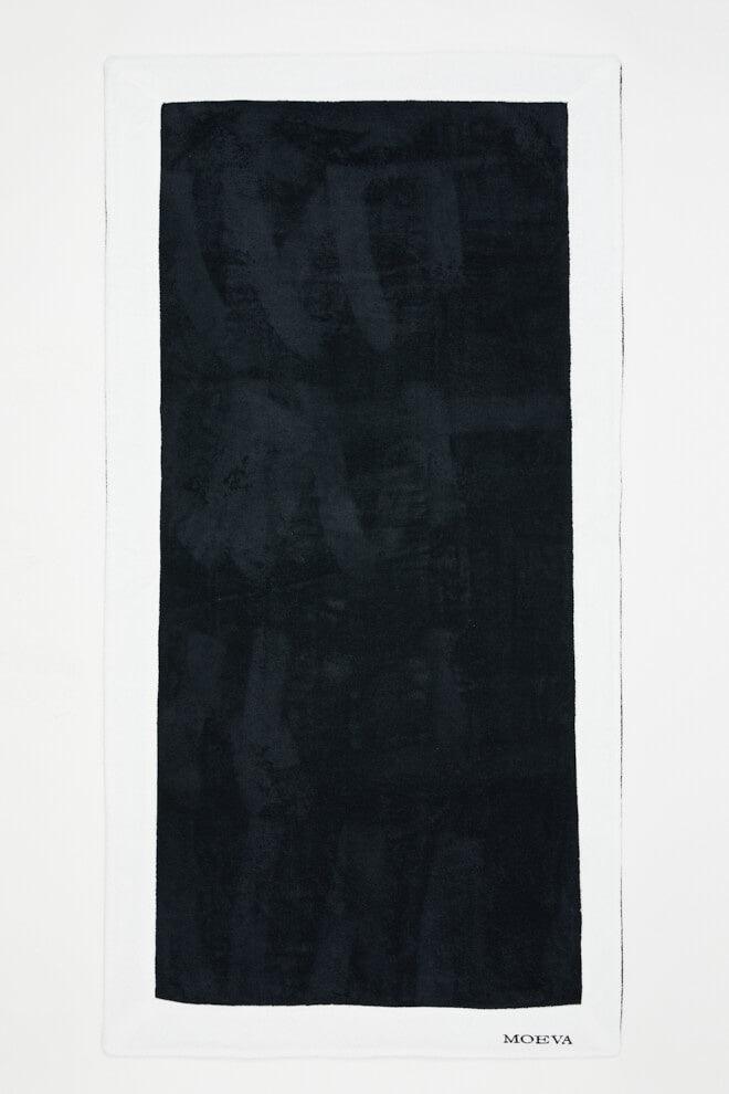 Front View of Monaco Black/White Towel - MOEVA Luxury Swimwear, Organic Turkish Cotton, Soft & Smooth, Full Reversible, Super Absorbent, Quick Drying, Embroidered Moeva logo, Length: 180 cm / Width: 100 cm, %100 Cotton, MOEVA Luxury Swimwear
