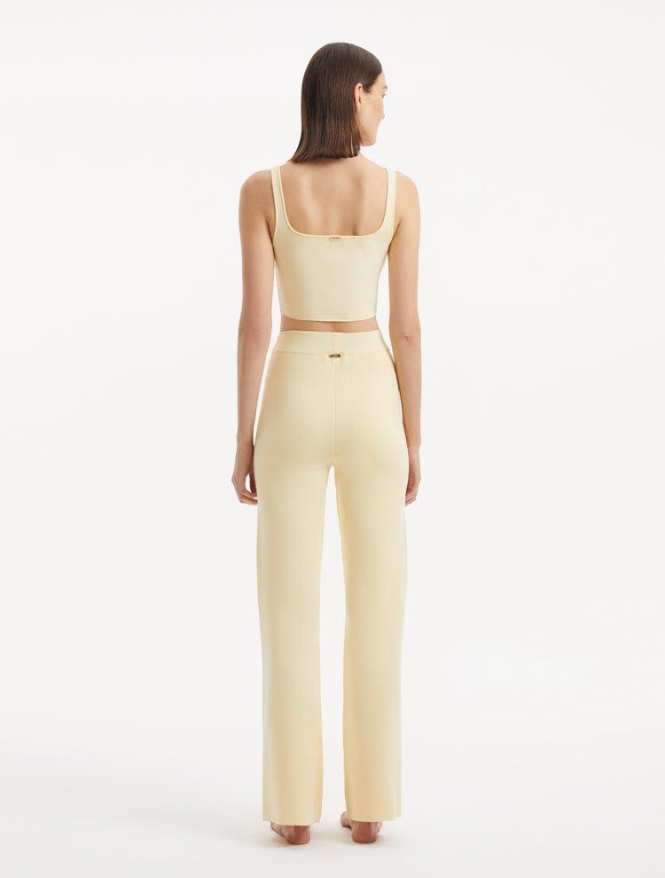 Murphy Yellow Knitted Scoop Neck Gold Buttoned Crop Top | Moeva | RTW Bustiers | Each week unveils new pieces—luxury swimwear, fluid resort silhouettes, and elevated summer-to-evening essentials designed to carry you from coastal escapes to city nights.