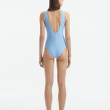 Naida Baby Blue V Neck Textured Swimsuit | Moeva | Swimsuit | Each week unveils new pieces—luxury swimwear, fluid resort silhouettes, and elevated summer-to-evening essentials designed to carry you from coastal escapes to city nights.