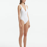 Naida White V Neck Textured Swimsuit | Moeva | Swimsuit | Each week unveils new pieces—luxury swimwear, fluid resort silhouettes, and elevated summer-to-evening essentials designed to carry you from coastal escapes to city nights.