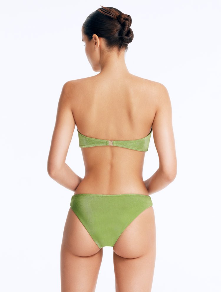 Back View: Model Wearing Nixie Green Bikini Bottom - Mid Rise, Hipster Style, Fully Lined, Italian Fabric, Movable Accessories, MOEVA Luxury Swimwear