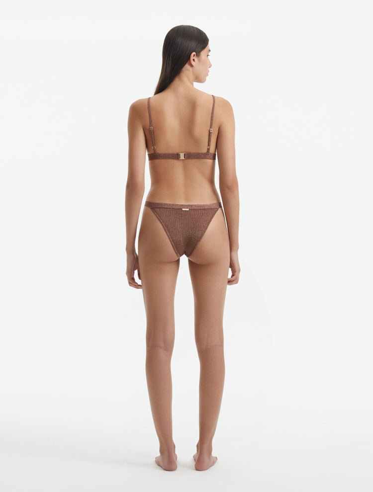 Back View: Model in North Brown Bikini Top - Triangle Top, Knitted, Ribbed, Metallic, Adjustable Straps, Clasps At The Back, Lined, MOEVA Luxury Swimwear   