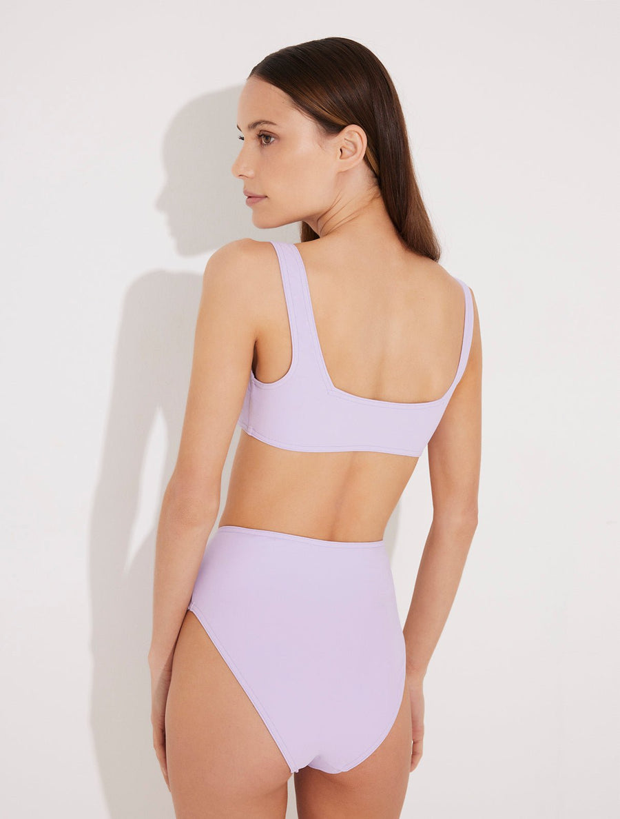 Back View: Model in Patrizia Lilac Bikini Bottom - MOEVA Luxury Swimwear, Lined, Italian Fabric, Special Lycra Xtralife Certificate, High-Waist Bikini Bottom,  MOEVA Luxury Swimwear  