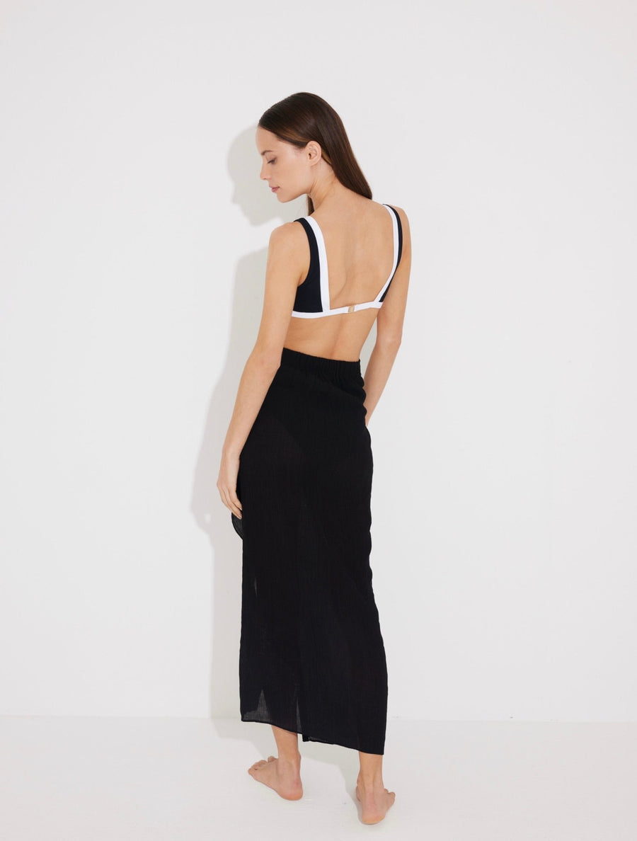 Back View: Model in Pina Black/White Skirt - MOEVA Luxury Swimwear, Duo Colored, Textured Fabric, Beachwear, Soft Touch Fabric, Unlined MOEVA Luxury Swimwear