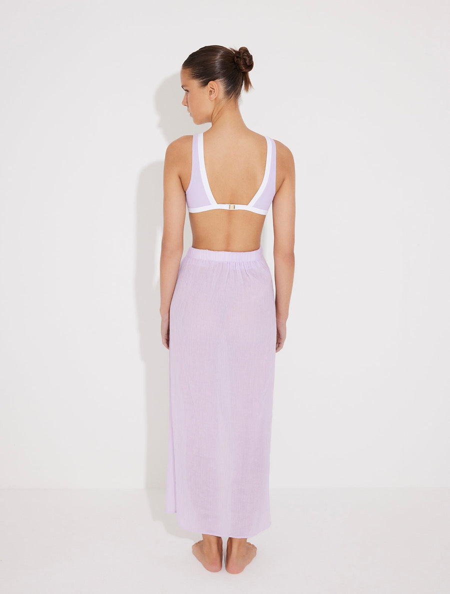 Back View: Model in Pina Lilac/White Skirt - MOEVA Luxury Swimwear, Duo Colored, Textured Fabric, Beachwear, Soft Touch Fabric, Unlined MOEVA Luxury Swimwear