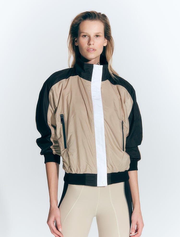 Pixie Black/Nude/White Jacket | Moeva | Activewear | Each week unveils new pieces—luxury swimwear, fluid resort silhouettes, and elevated summer-to-evening essentials designed to carry you from coastal escapes to city nights.