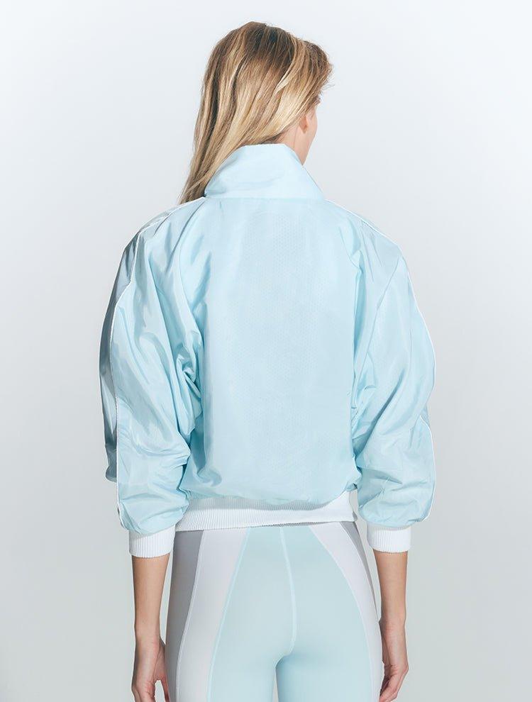 Pixie Green/Grey/White Jacket | Moeva | Activewear | Each week unveils new pieces—luxury swimwear, fluid resort silhouettes, and elevated summer-to-evening essentials designed to carry you from coastal escapes to city nights.