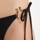 Laura Badura - Rhea Black Triangle Side Tie Satin Bikini Set | Moeva | | Each week unveils new pieces—luxury swimwear, fluid resort silhouettes, and elevated summer-to-evening essentials designed to carry you from coastal escapes to city nights.