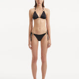 Rhea Black Side Tie Satin Bikini Bottom | Moeva | Bikini Bottom | Each week unveils new pieces—luxury swimwear, fluid resort silhouettes, and elevated summer-to-evening essentials designed to carry you from coastal escapes to city nights.
