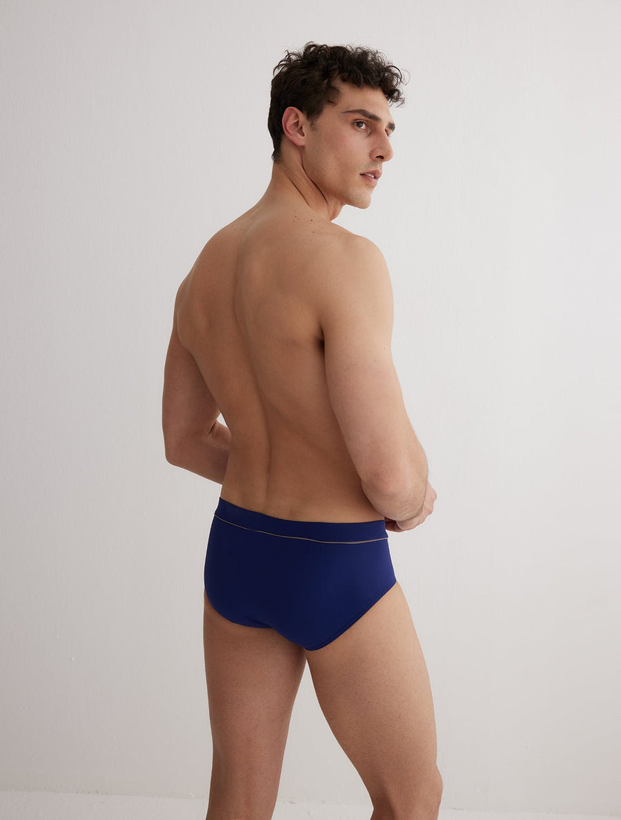 Back View: Model in Ricardo Blue/Grey/Baby Blue Briefs - MOEVA Luxury Swimwear, Swim Shorts, Nikel, Brief, Fully Lined, Slim Fit, Strech Classic, MOEVA Luxury Swimwear