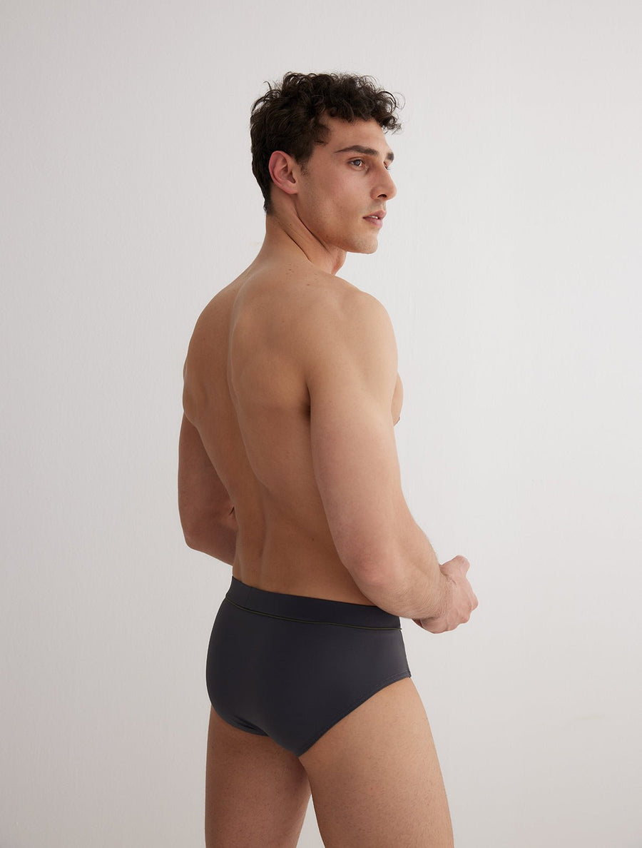 Back View: Model in Ricardo Grey/Green/White Blue Briefs - MOEVA Luxury Swimwear, Swim Shorts, Nikel, Brief, Fully Lined, Slim Fit, Strech Classic, MOEVA Luxury Swimwear