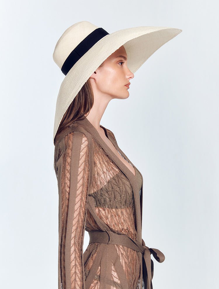 Front View: Model in Romana Black Hat - Wide Brim, Grosgrain Trim, Moeva Logo Plaque, 100% Toquilla Straw, MOEVA Luxury Swimwear