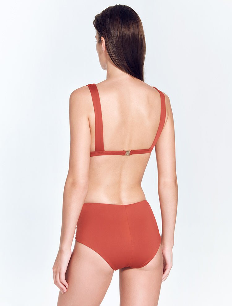Back View: Model in Rylee Red Ochre Bikini Top - MOEVA Luxury Swimwear, Gold Clasps at the Back, Lycra XtraLife® Certificate, Italian Fabric, Comfort, MOEVA Luxury Swimwear