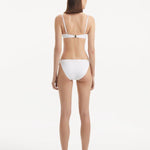 Doina - Salila White Underwired Side Tie Wave Textured Bikini Set | Moeva | Bikini Set | Each week unveils new pieces—luxury swimwear, fluid resort silhouettes, and elevated summer-to-evening essentials designed to carry you from coastal escapes to city nights.