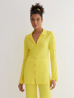 Front View: Model in Salome Yellow Shirt - MOEVA Luxury Swimwear, Knitted Shirt, Long Sleeved, Button Details Along Sleeves and Front, Close Fit, MOEVA Luxury Swimwear