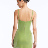 Senna Green Cut-Out Mini Dress with Accessory Detail | Moeva | RTW Dresses | Each week unveils new pieces—luxury swimwear, fluid resort silhouettes, and elevated summer-to-evening essentials designed to carry you from coastal escapes to city nights.