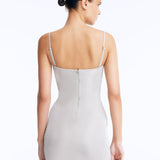 Senna Silver Cut-Out Mini Dress with Accessory Detail | Moeva | RTW Dresses | Each week unveils new pieces—luxury swimwear, fluid resort silhouettes, and elevated summer-to-evening essentials designed to carry you from coastal escapes to city nights.