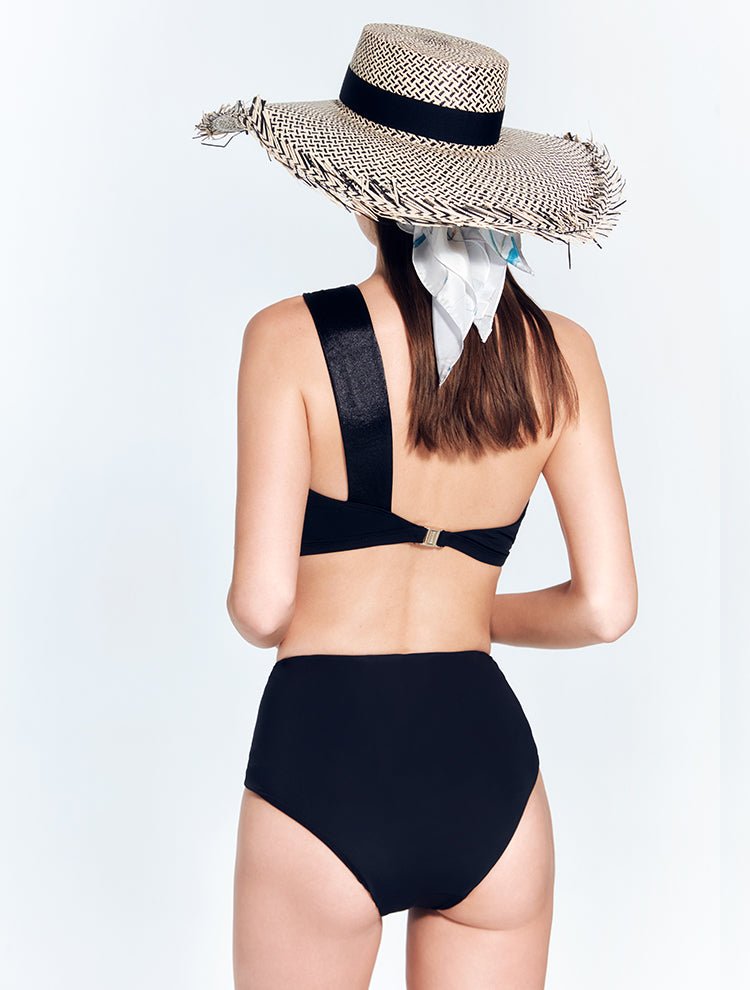 Back View: Model in Skylar Black Bikini Bottom - MOEVA Luxury Swimwear, Fully Lined, Comfort and Signature, Soft Touch Italian Fabric, Special Lycra Xtralife® Certificate, MOEVA Luxury Swimwear