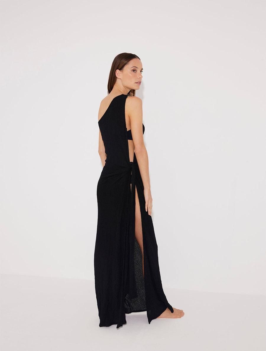 Back View: Model in Stefania Black Dress - MOEVA Luxury Swimwear, Soft Recycle Fabric, Maxi Dress, Unlined, Recycle Fabric, Comfort Maxi Dress, MOEVA Luxury Swimwear