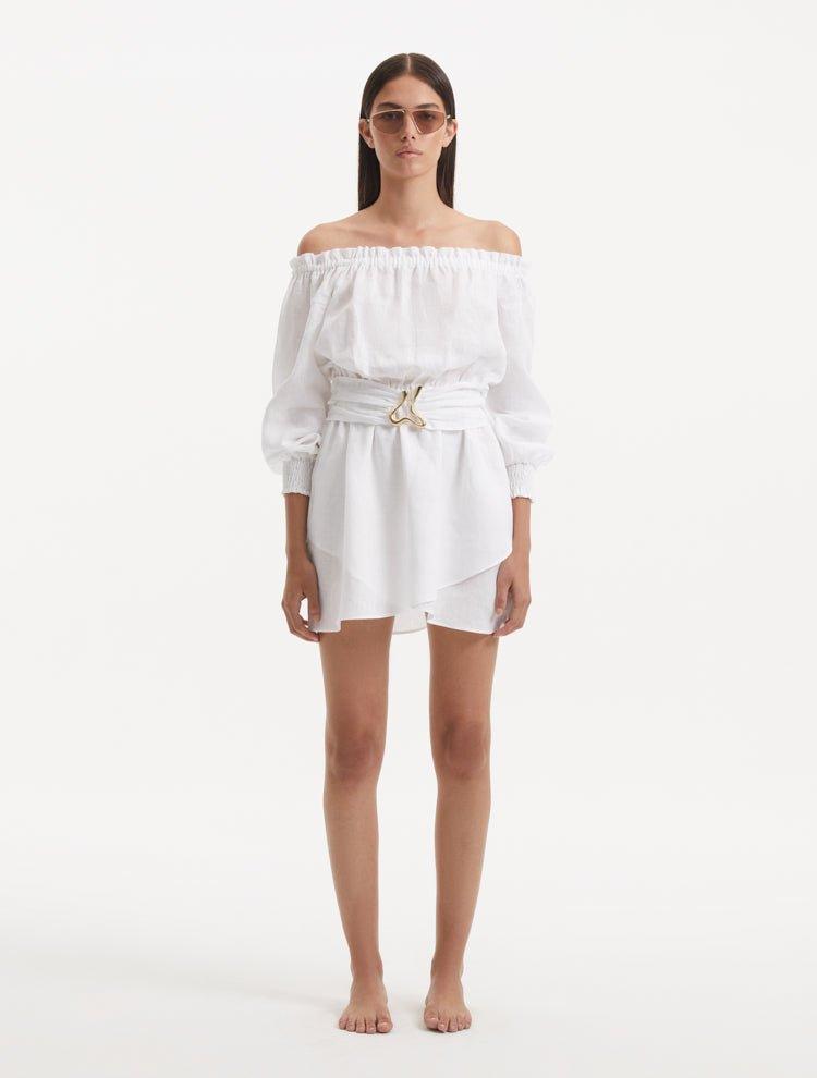 Sumner White Off-Shoulder Linen Mini Dress | Moeva | RTW Dresses | Each week unveils new pieces—luxury swimwear, fluid resort silhouettes, and elevated summer-to-evening essentials designed to carry you from coastal escapes to city nights.