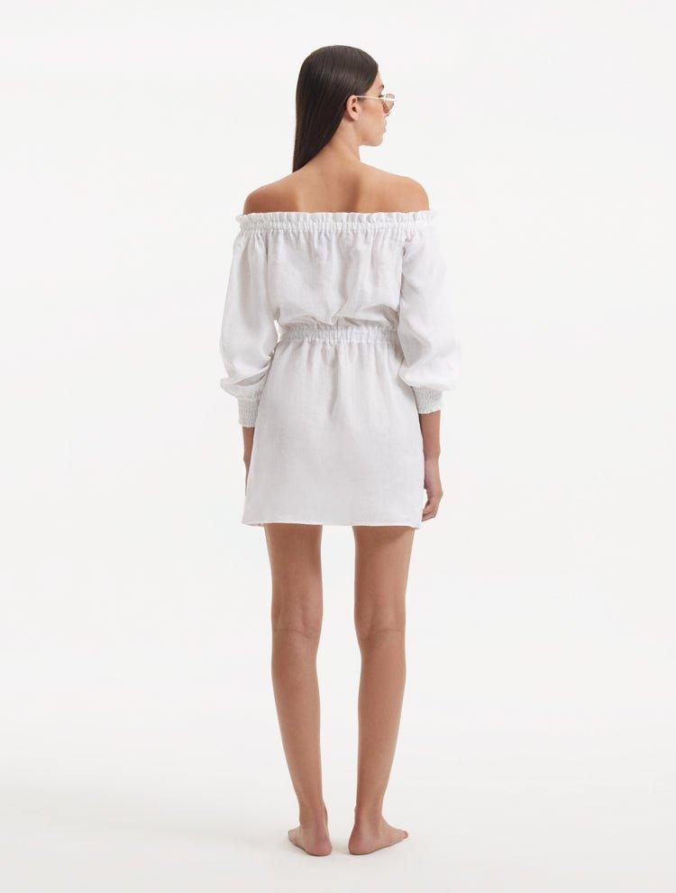Sumner White Off-Shoulder Linen Mini Dress | Moeva | RTW Dresses | Each week unveils new pieces—luxury swimwear, fluid resort silhouettes, and elevated summer-to-evening essentials designed to carry you from coastal escapes to city nights.