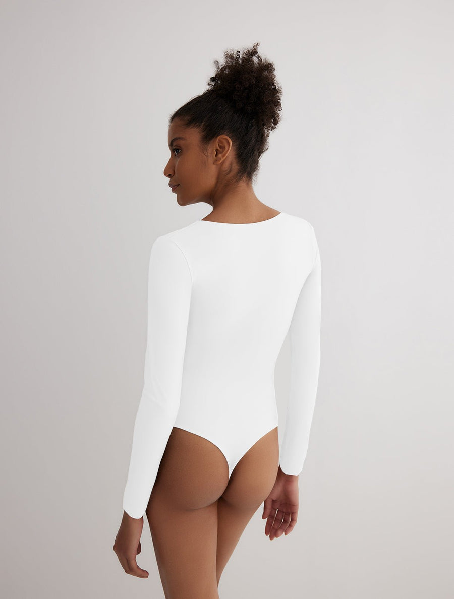 Back View: Model in Ulrika Grey/White Reversible Bodysuit - MOEVA Luxury Swimwear, One Piece Bodysuits, Fully Lined, Comfort and Sportive, Reversible Stretchy Fabric, MOEVA Luxury Swimwear