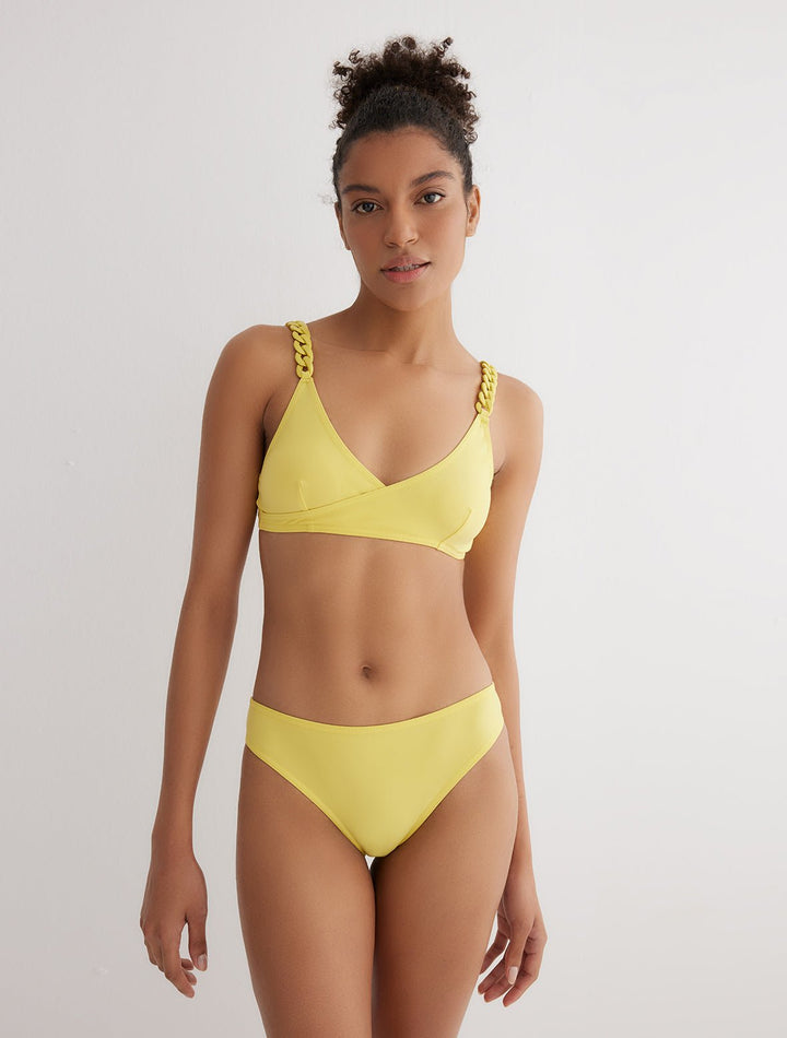 Front View: Model in Vilhelmina Yellow Bikini Top - MOEVA Luxury Swimwear, Soft Touch Fabric, Fully Lined, V Neckline, ABS Chain Straps, Removable Paddings, MOEVA Luxury Swimwear