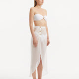 Xander White Sheer Maxi Skirt with Gold Button Details | Moeva | Beachwear Skirts | Each week unveils new pieces—luxury swimwear, fluid resort silhouettes, and elevated summer-to-evening essentials designed to carry you from coastal escapes to city nights.