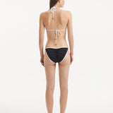 Zarya Black Triangle Textured Mid Coverage Bikini Set | Moeva | | Each week unveils new pieces—luxury swimwear, fluid resort silhouettes, and elevated summer-to-evening essentials designed to carry you from coastal escapes to city nights.