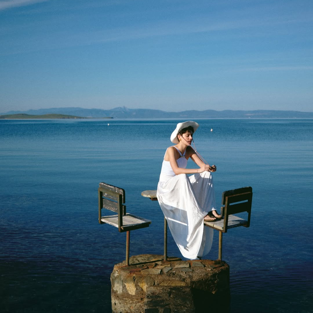 5eleven Mag Editorial - Lyra White Halter Swimsuit | Moeva | Swimsuit | Each week unveils new pieces—luxury swimwear, fluid resort silhouettes, and elevated summer-to-evening essentials designed to carry you from coastal escapes to city nights.