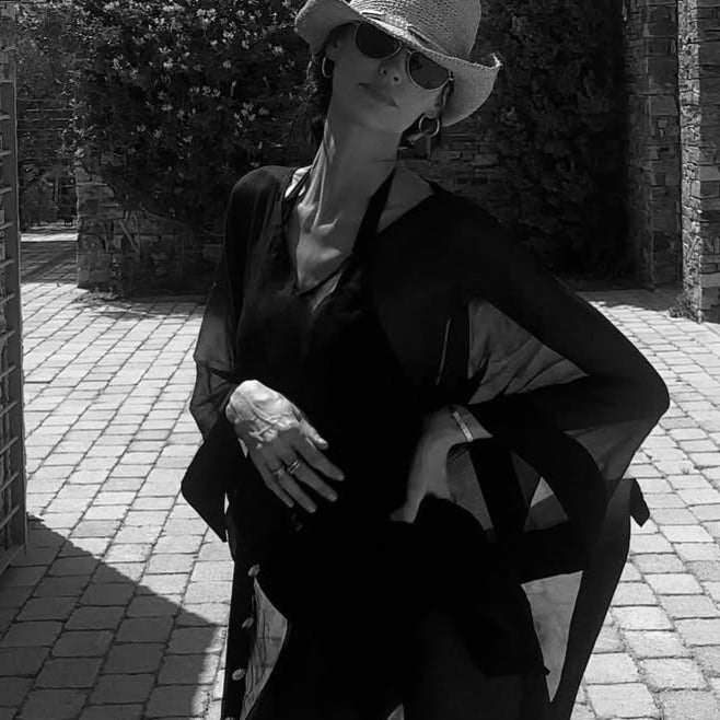 Bianca Ella Booth-Tata Black Sheer Gold Buttoned Belted Kaftan with Asymmetric Hem | Moeva | Kaftan | Each week unveils new pieces—luxury swimwear, fluid resort silhouettes, and elevated summer-to-evening essentials designed to carry you from coastal escapes to city nights.