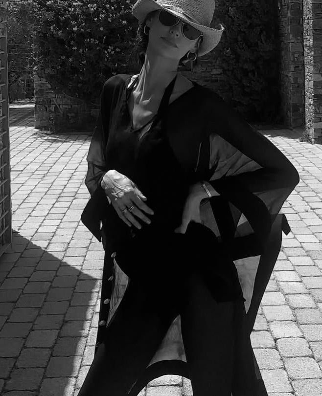 Bianca Ella Booth-Tata Black Sheer Gold Buttoned Belted Kaftan with Asymmetric Hem | Moeva | Kaftans | Each week unveils new pieces—luxury swimwear, fluid resort silhouettes, and elevated summer-to-evening essentials designed to carry you from coastal escapes to city nights.