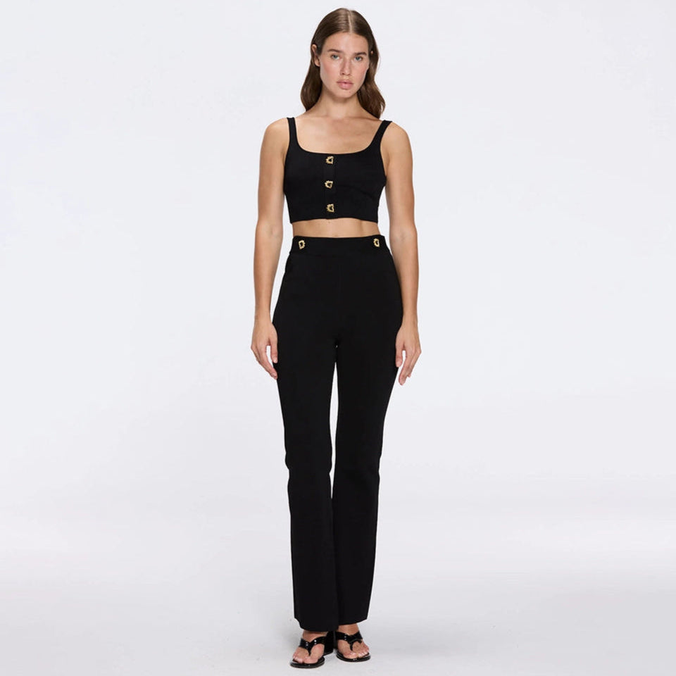 Aureline Black Knitted Scoop Neck Gold Buttoned Crop Top | Moeva | Crop Top | Each week unveils new pieces—luxury swimwear, fluid resort silhouettes, and elevated summer-to-evening essentials designed to carry you from coastal escapes to city nights.