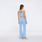 Aureline Blue Knitted Scoop Neck Gold Buttoned Crop Top | Moeva | RTW Bustiers | Each week unveils new pieces—luxury swimwear, fluid resort silhouettes, and elevated summer-to-evening essentials designed to carry you from coastal escapes to city nights.