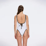 Azurea Underwired Gold Button Detail White Swimsuit | Moeva | Swimsuit | Each week unveils new pieces—luxury swimwear, fluid resort silhouettes, and elevated summer-to-evening essentials designed to carry you from coastal escapes to city nights.