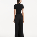 "Manami Black Pants from the back, focusing on the high waist and hidden zip feature. "