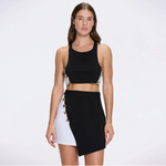 Riviera Black-White Duo-Colored Asymmetric Gold Button Mini Skort | Moeva | Skirt | Each week unveils new pieces—luxury swimwear, fluid resort silhouettes, and elevated summer-to-evening essentials designed to carry you from coastal escapes to city nights.