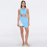 Riviera Blue-White Duo-Colored Asymmetric Gold Button Mini Skort | Moeva | Skirt | Each week unveils new pieces—luxury swimwear, fluid resort silhouettes, and elevated summer-to-evening essentials designed to carry you from coastal escapes to city nights.